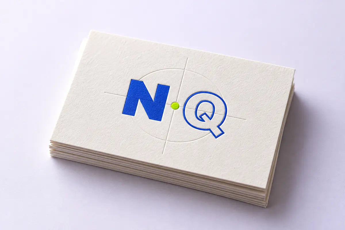 Embossed NQ monogram on tactile ivory cards